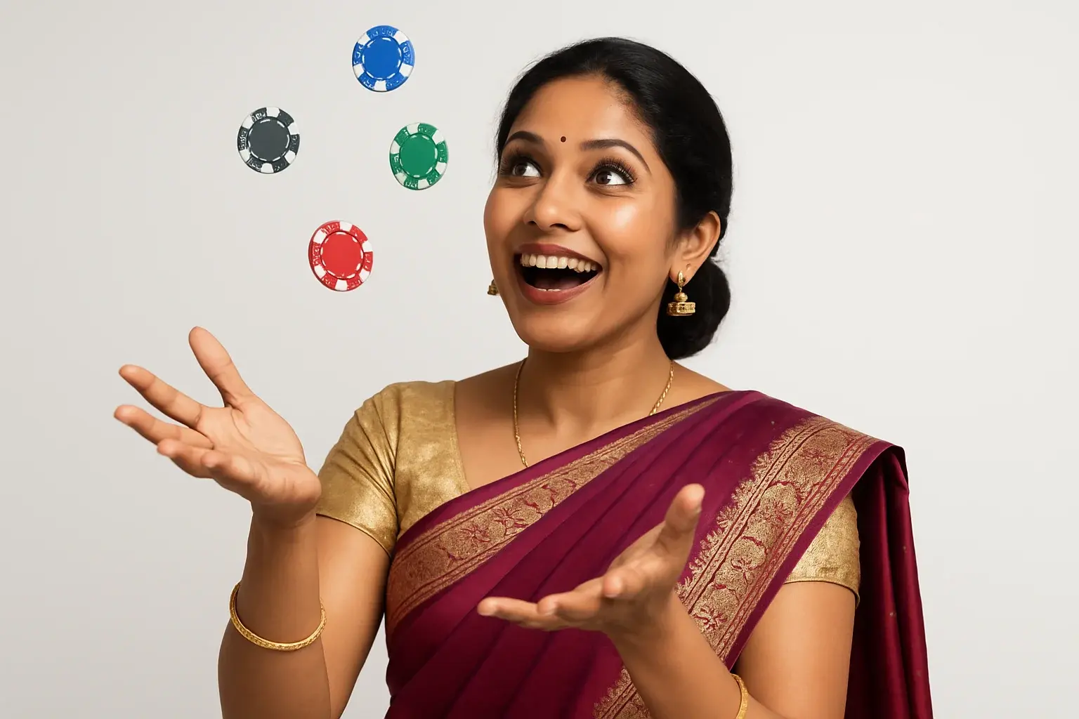 Excited Bangladeshi woman in elegant saree catching falling casino chips